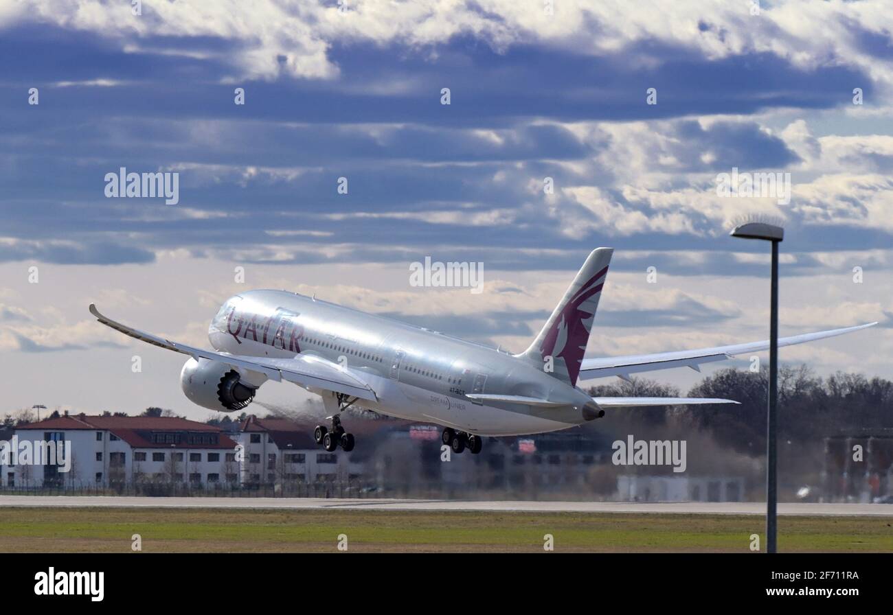 03 April 2021, Brandenburg, Schönefeld: A Boeing 787 Dreamliner of the airline Qatar Airways takes off from the southern runway of Berlin Brandenburg Airport 'Willy Brandt' in the direction of Doha. Since the beginning of April 2021, both runways have been used in monthly rotation in order to distribute aircraft noise pollution more evenly in the region. Photo: Soeren Stache/dpa-Zentralbild/dpa Stock Photo