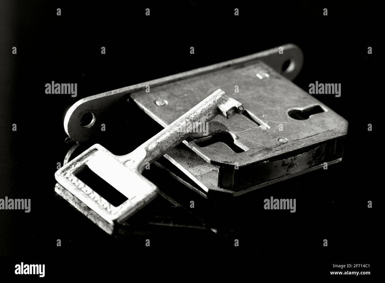 A door lock and a key on black background Stock Photo Alamy