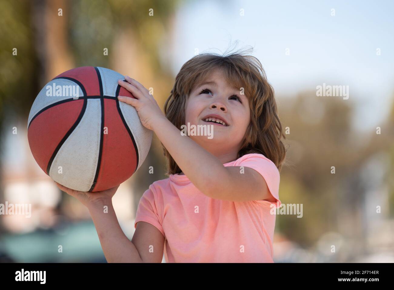 Basketball child player, cheerful and pleasant. Basket ball kids school