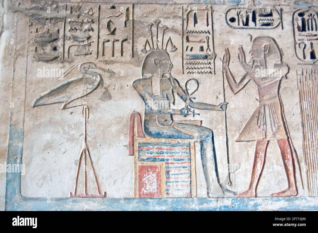 An Ancient Egyptian hieroglyphic carving showing the Pharoah Ramses II praising the goddess of the Nile - happy - and an Ibis water bird. Carving thou Stock Photo