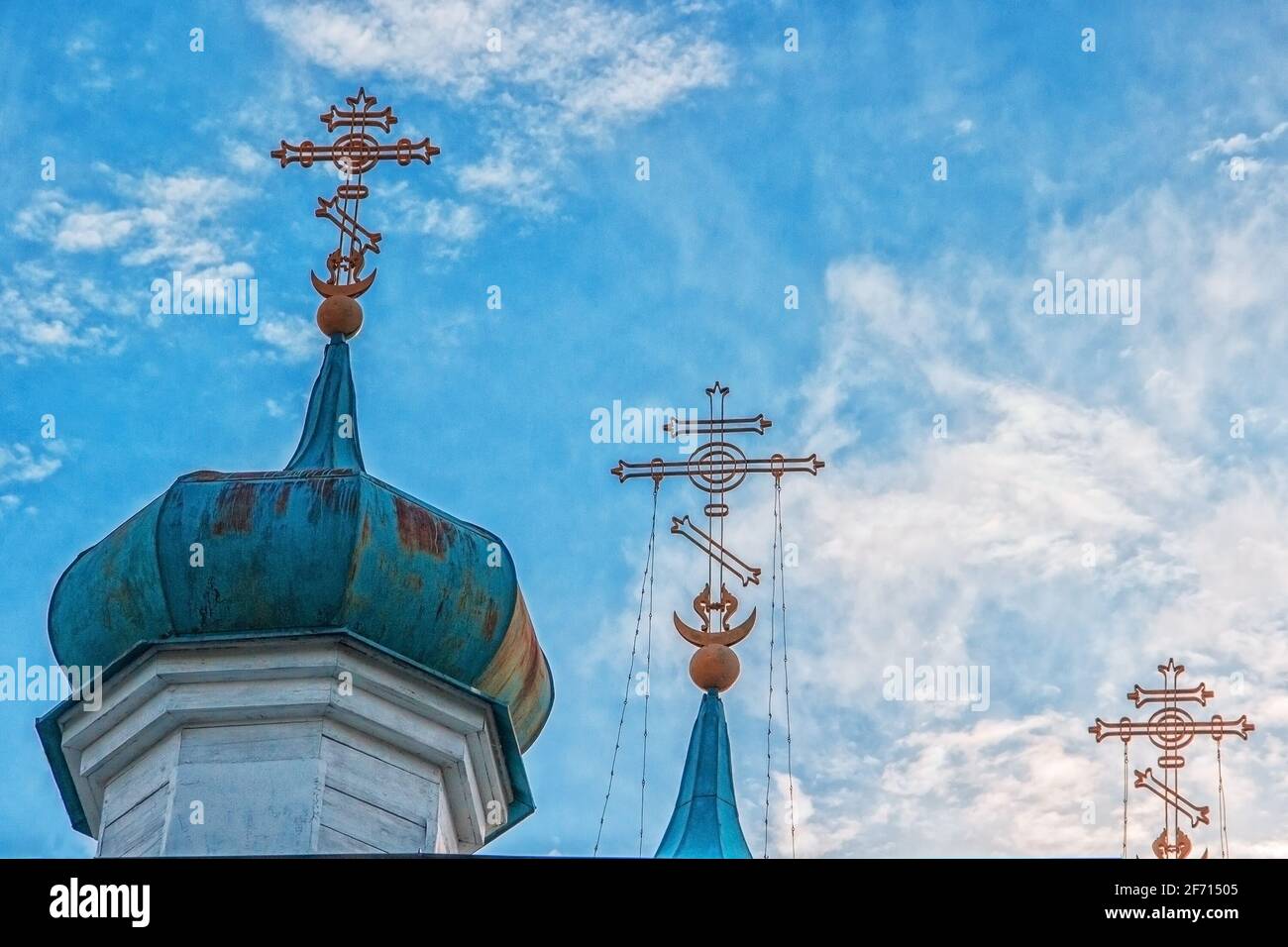 domes of the Orthodox church with crosses on blue sky background with ...