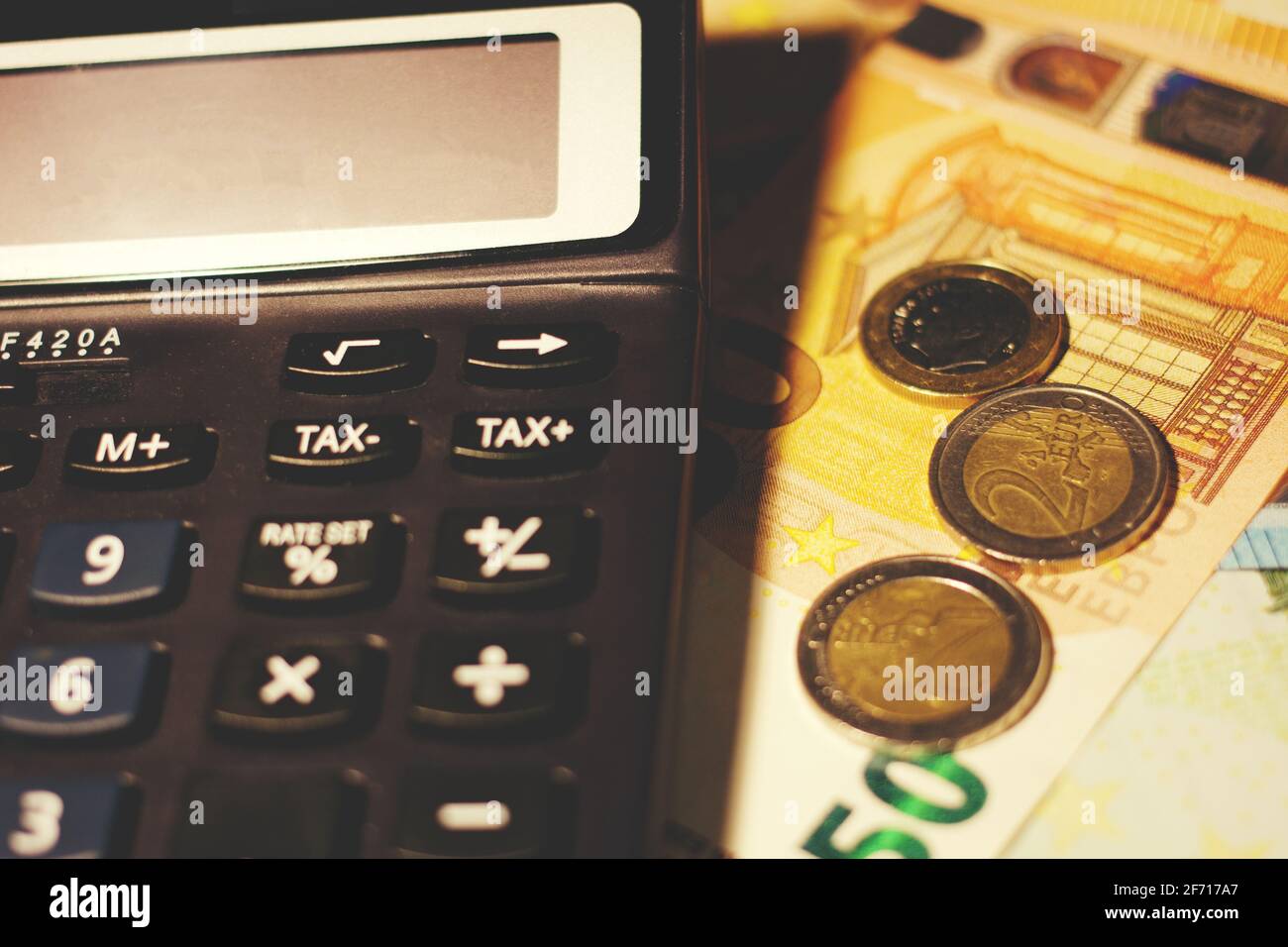 Calculator with the sign CoronaVirus, concept of economic impact Stock Photo