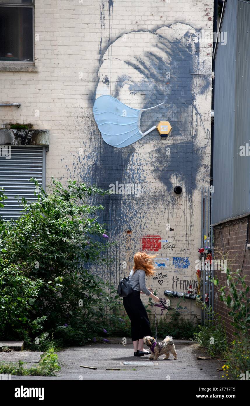 The Coronavirus inspired adaptation of Vermeer’s Girl With A Pearl Earing attributed to Banksy in Bristol, UK Stock Photo