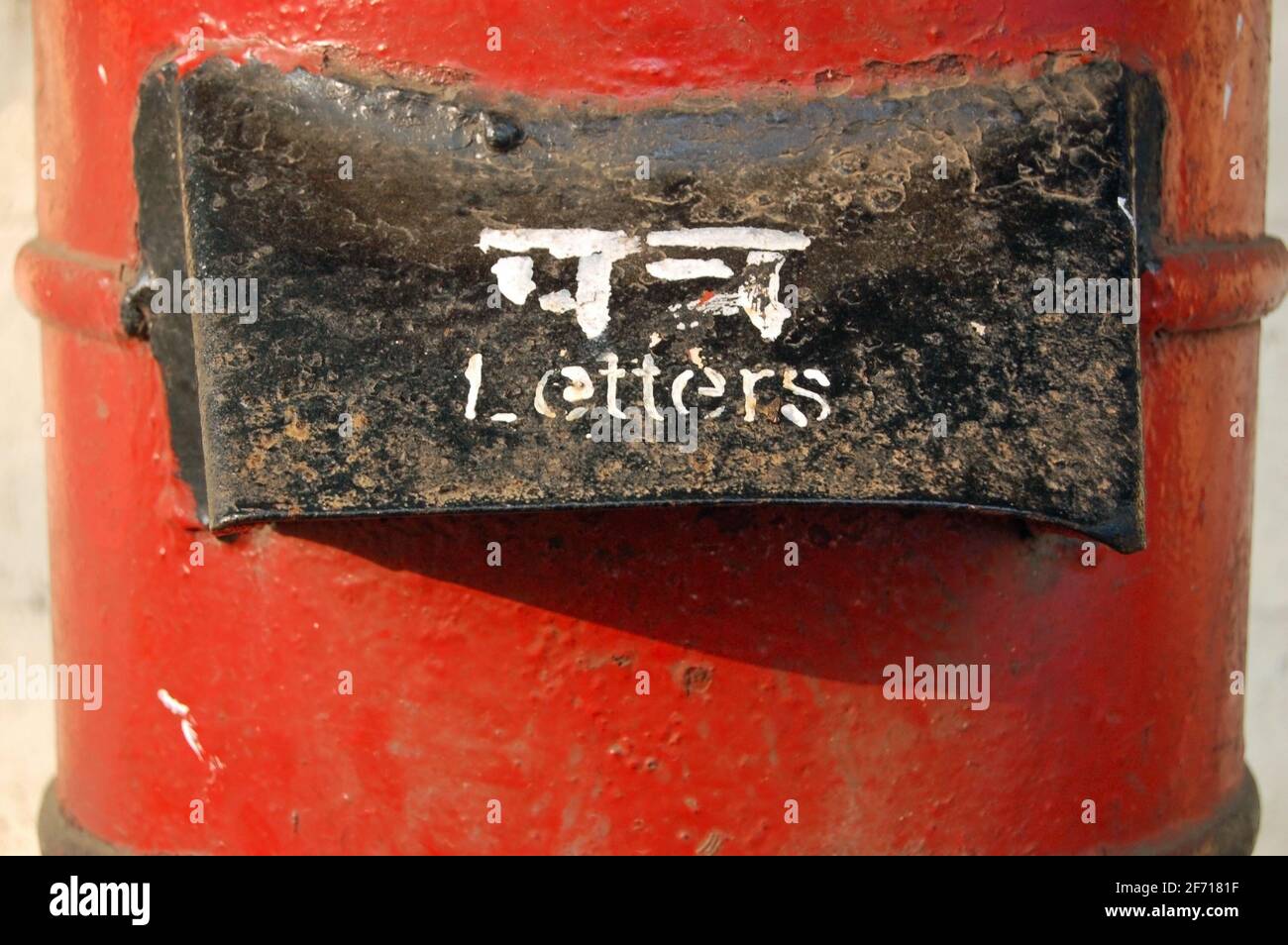 The covered slot at the top of a red pillarbox for posting letters in Mumbai (Bombay), India. Stock Photo