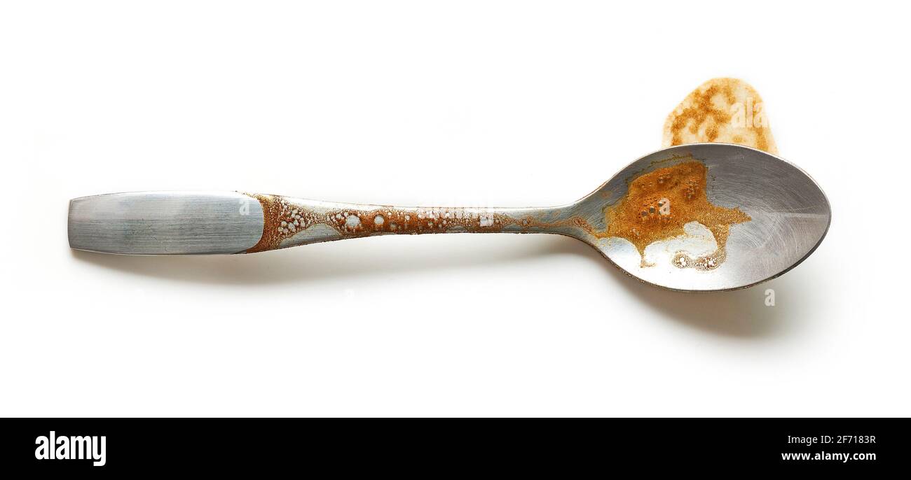 dirty coffee spoon isolated on white background, top view Stock Photo