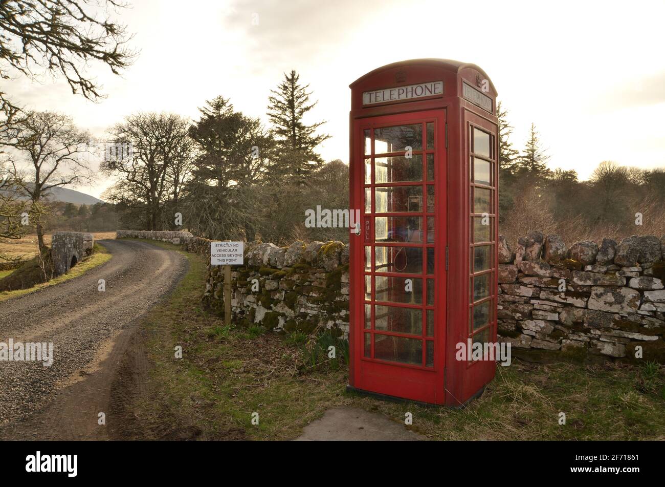 A traditional British red telephone box, type K6, still in working order (2021) situated at Breamore in the northern Scottish Highlands, Great Britain Stock Photo