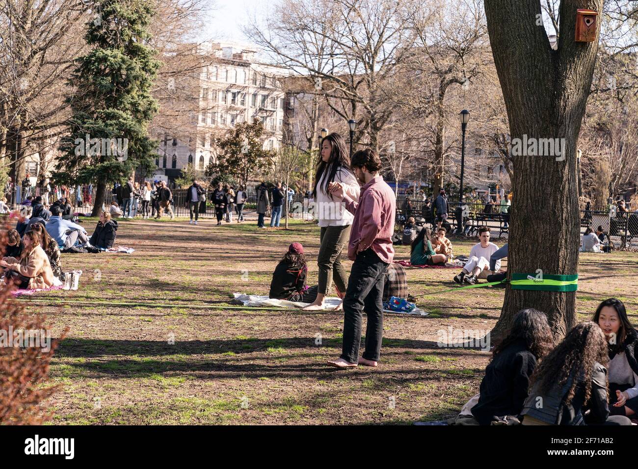 New York, United States. 03rd Apr, 2021. New Yorkers enjoy sunny spring Saturday in Washington Square and Tompkins Square Parks. A woman learns to walk on tightrope. (Photo by Lev Radin/Pacific Press) Credit: Pacific Press Media Production Corp./Alamy Live News Stock Photo