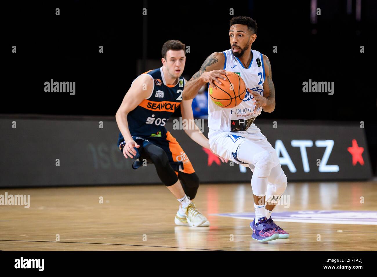 Karlsruhe, Deutschland. 03rd Apr, 2021. Tyseem Lamel Lyles (Lions) in duels  with Tyler Nelson (Rostock). GES/Basketball/ProA: PSK Lions - Rostock  Seawolves, 03.04.2021 - | usage worldwide Credit: dpa/Alamy Live News Stock  Photo - Alamy