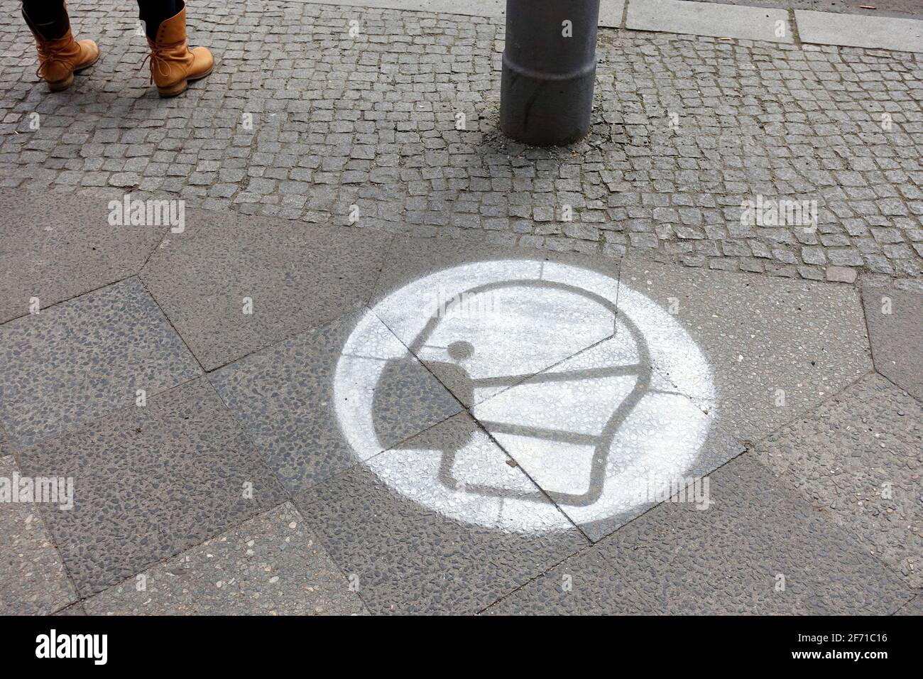 Sprayed mask in four different languages, English, Arabic, Turkish and