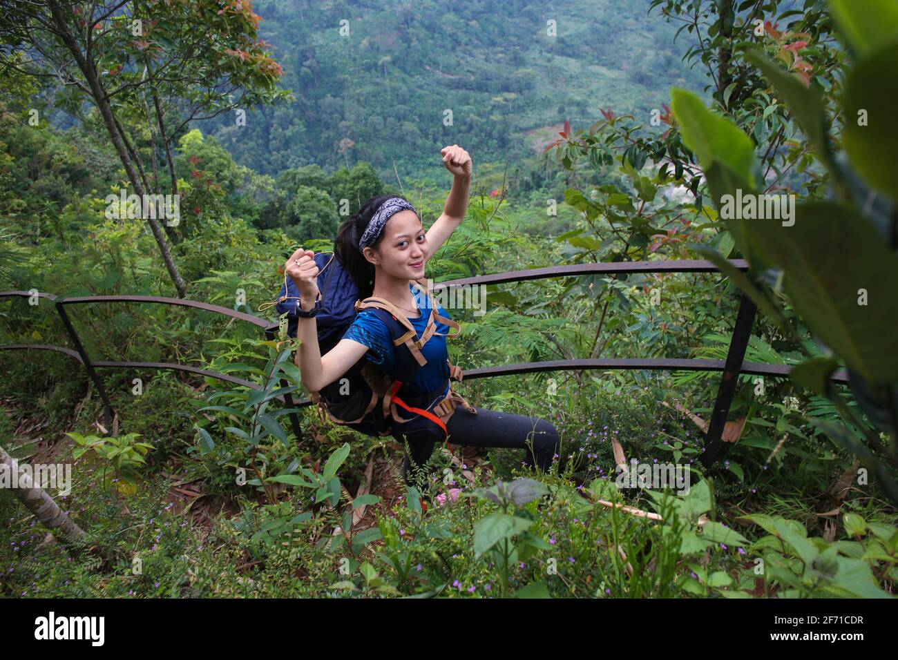 young asian woman backpacker climbing mountain Stock Photo Alamy