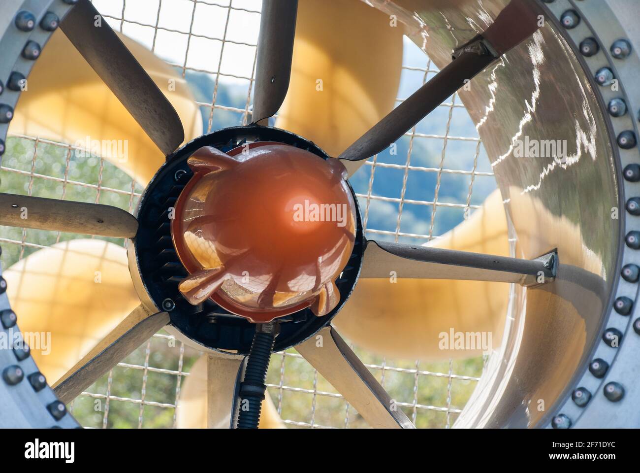 Front part of the snow cannon on a ski slope, detail of the protection mesh and the blades in a duct. Detail of ducted fan of a snow cannon. Stock Photo