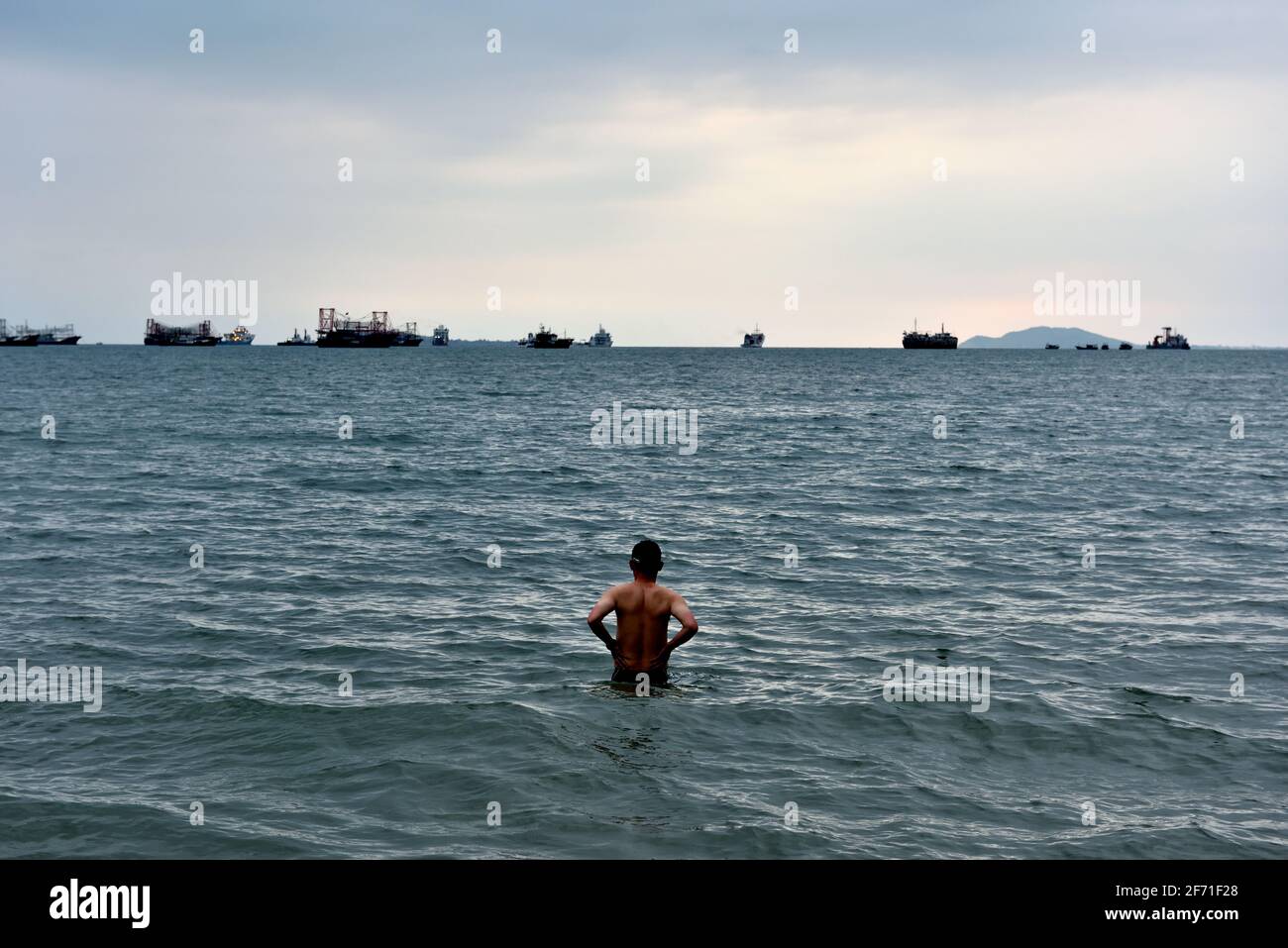 Young man preparing to swim Stock Photo