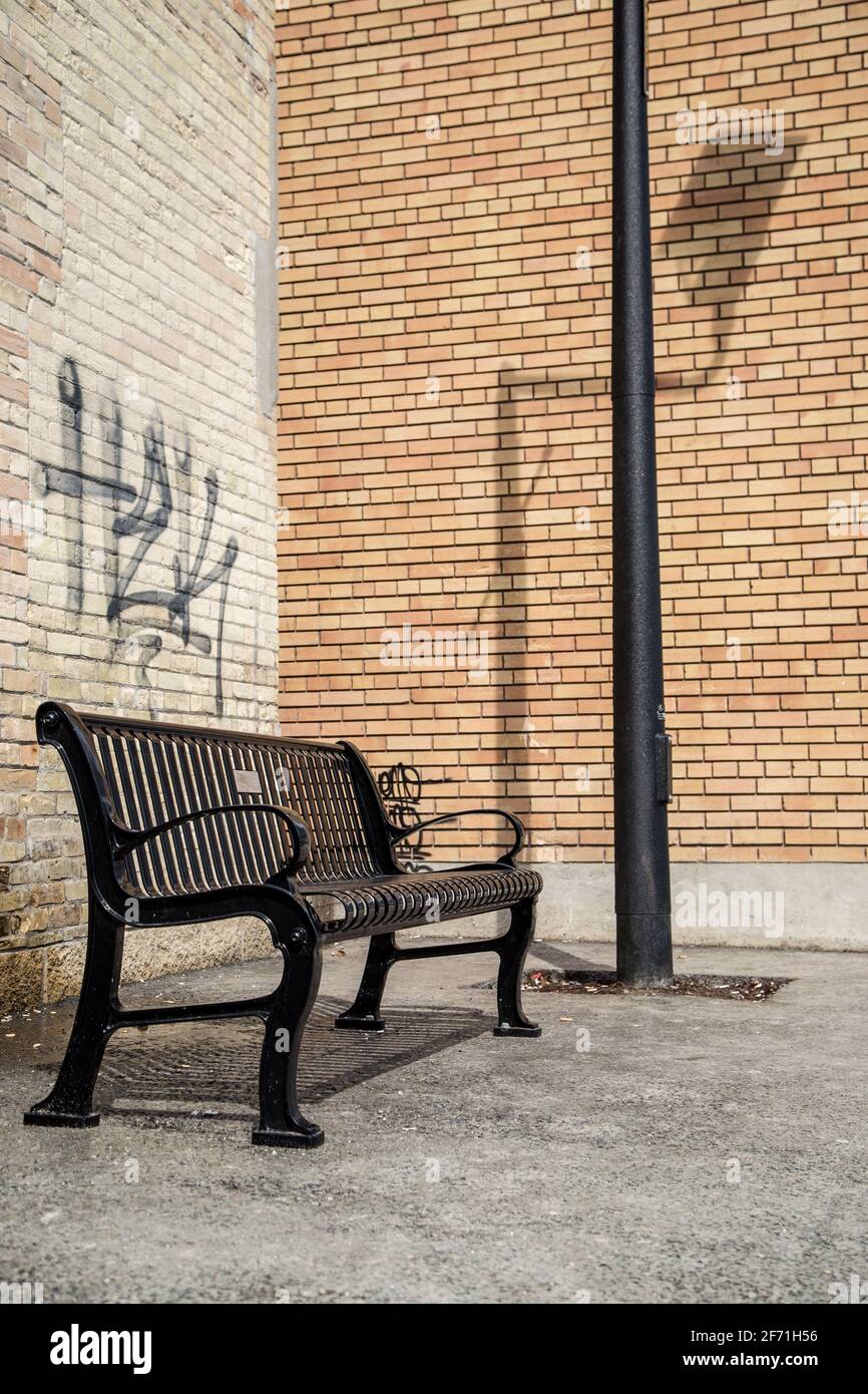 Bench brick wall hi-res stock photography and images - Alamy