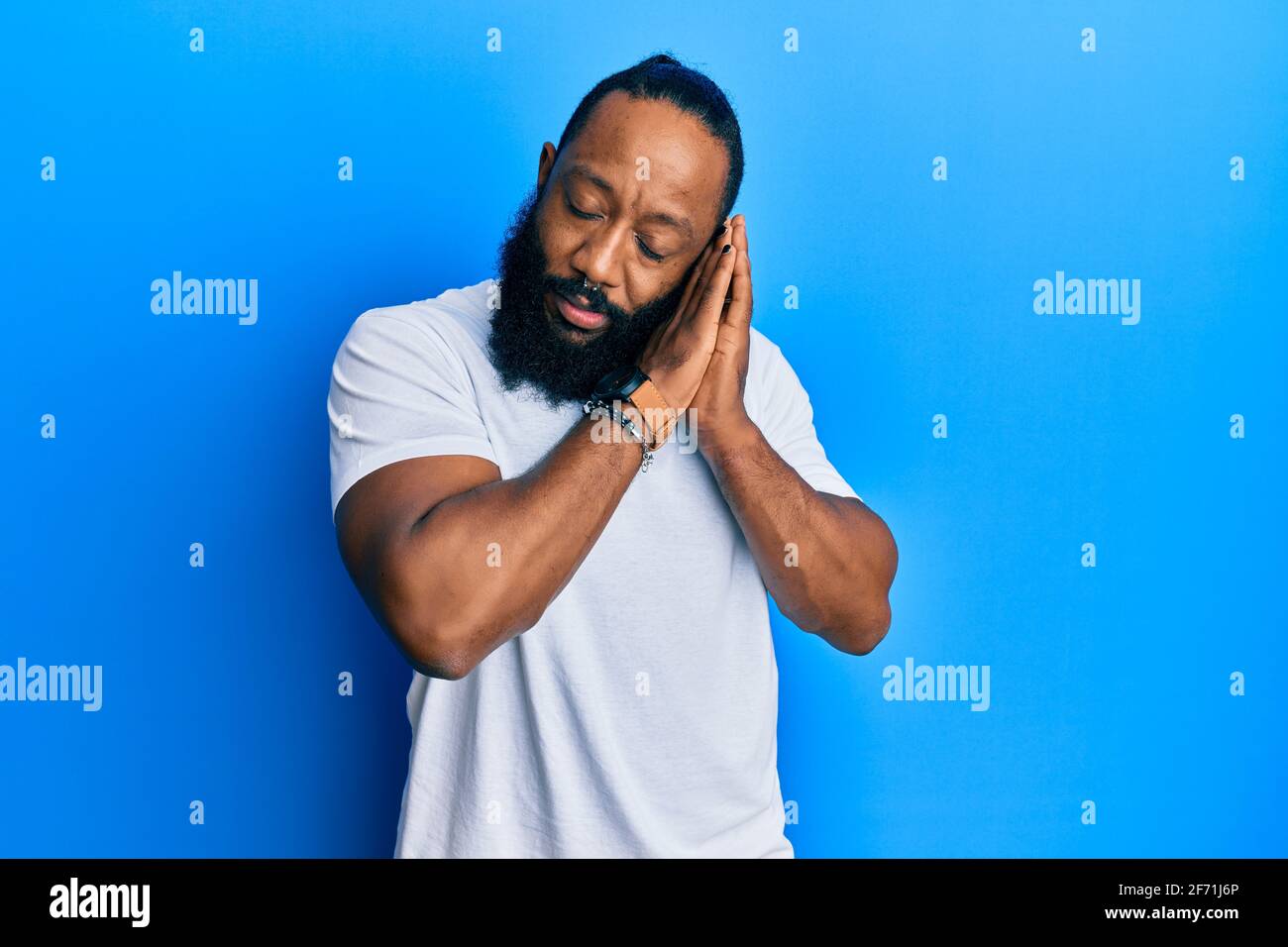 Young African American Man Wearing Casual White Tshirt Sleeping Tired 