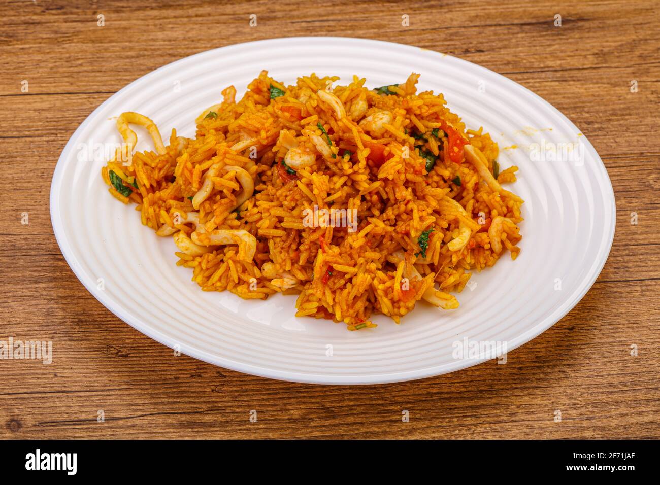 Asian cuisine - fried rice with prawn and squid Stock Photo - Alamy