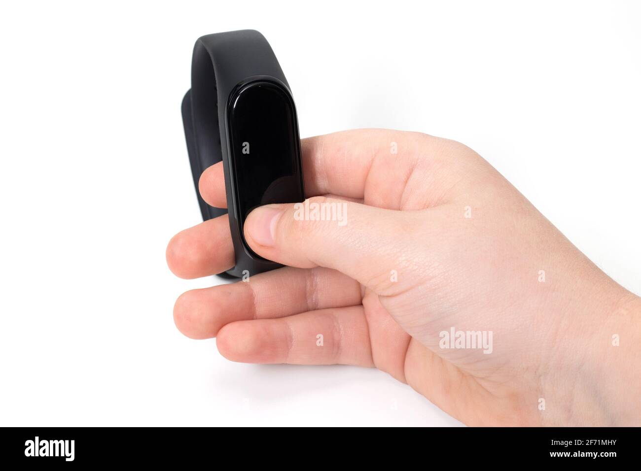 Hand with fitness bracelet on a white background. Stock Photo