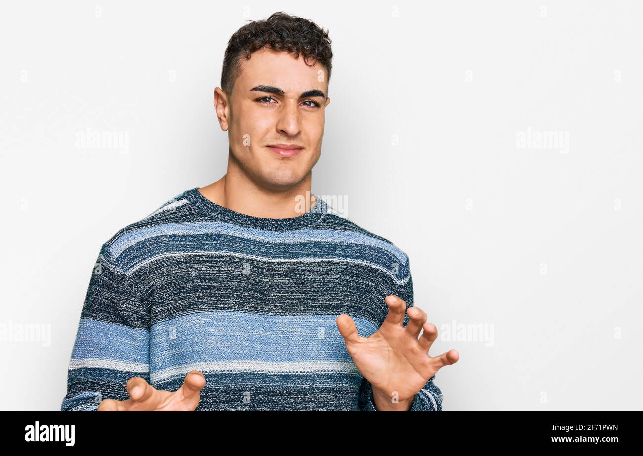 Hispanic young man wearing casual clothes disgusted expression ...
