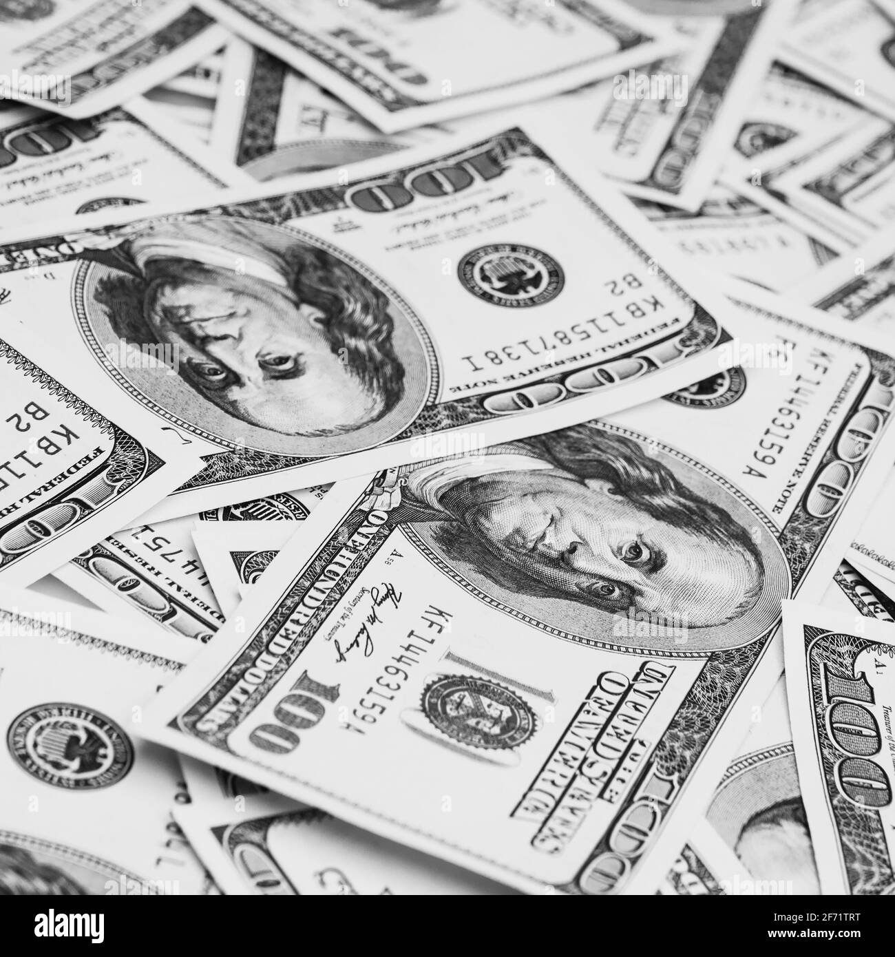 Scattered 100 us dollar bills Black and White Stock Photos & Images - Alamy