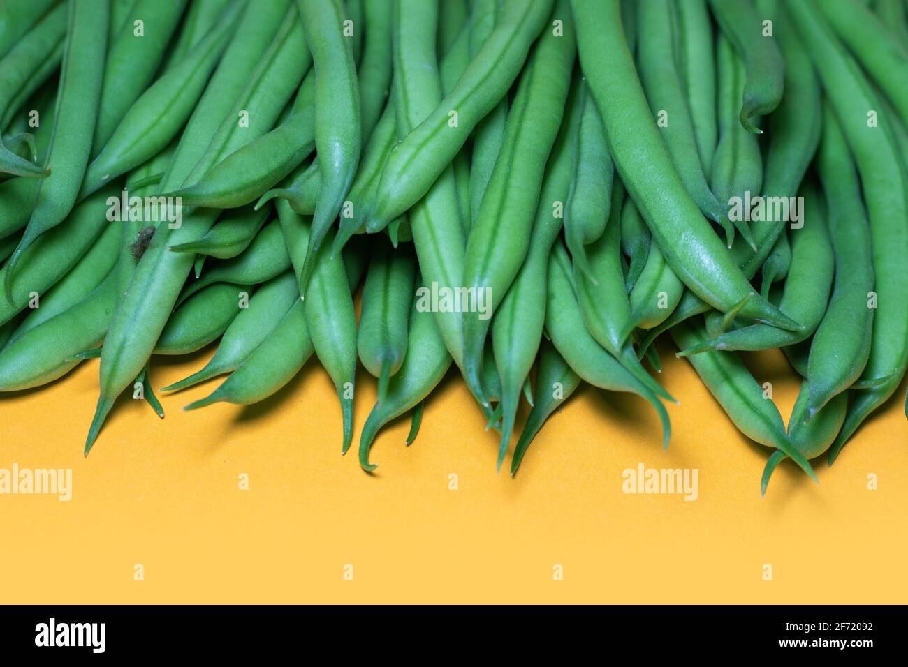 Green beans on a yellow background. copy space Stock Photo Alamy