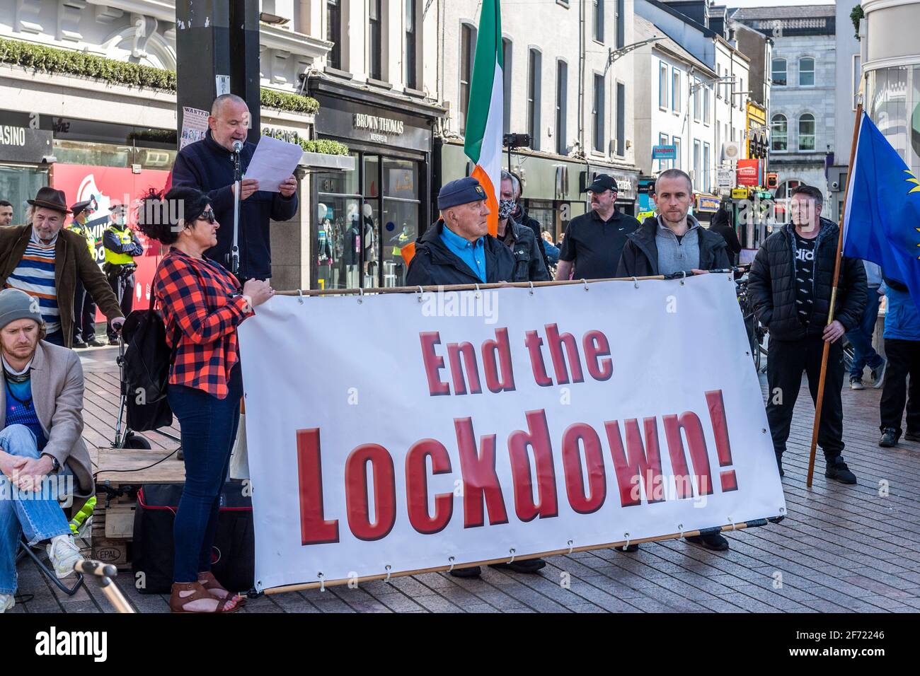Cork, Ireland. 3rd Apr, 2021. An 'End the Lockdown' protest tokk place in Cork today, the second such event in the space of a month. Approximately 300 people attended in the midst of a heavy Garda presence. The protesters held a rally outside Brown Thomas on Patrick Street after the march. Protest organiser Diarmaid ' Cadhla spoke at the rally. Credit: AG News/Alamy Live News Stock Photo