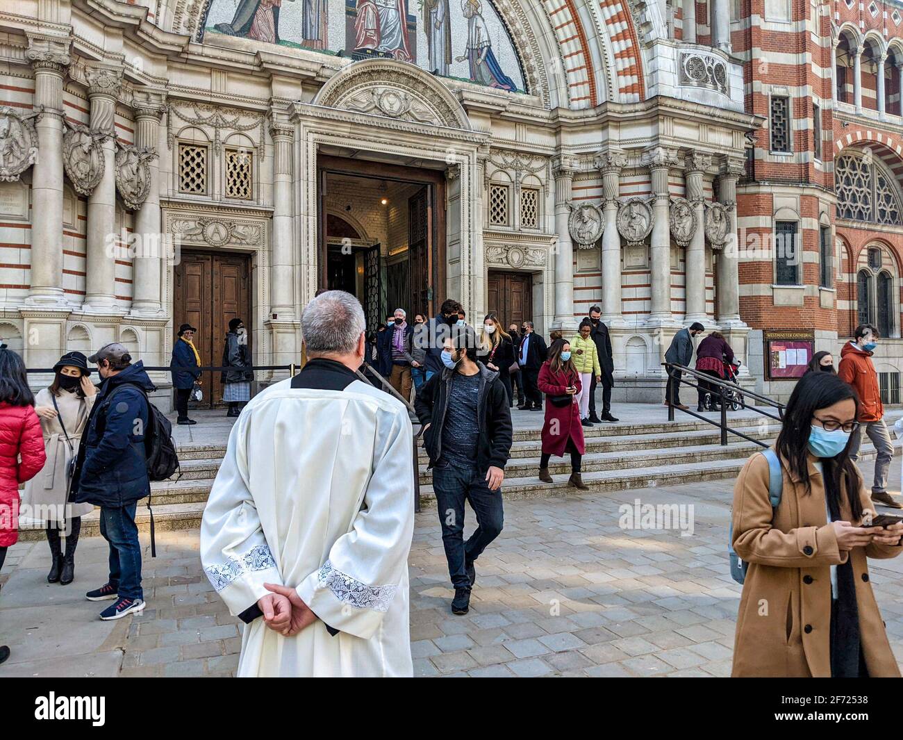 London, UK. 4th April 2021. Congregation exiting Westminster Cathedral