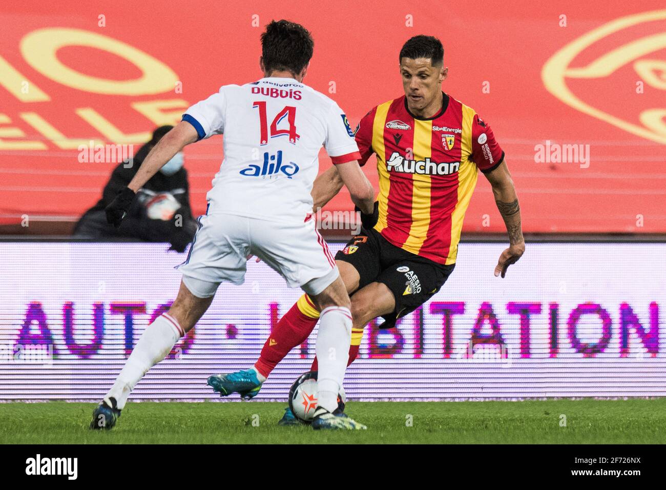 LensâÂ€Â™ French forward Florian Sotoca fights for the ball with LyonâÂ€Â™s  French defender Leo Dubois during the Ligue 1 football match between RC  Lens (RCL) and Olympique Lyonnais (OL) at Stade Bollaert