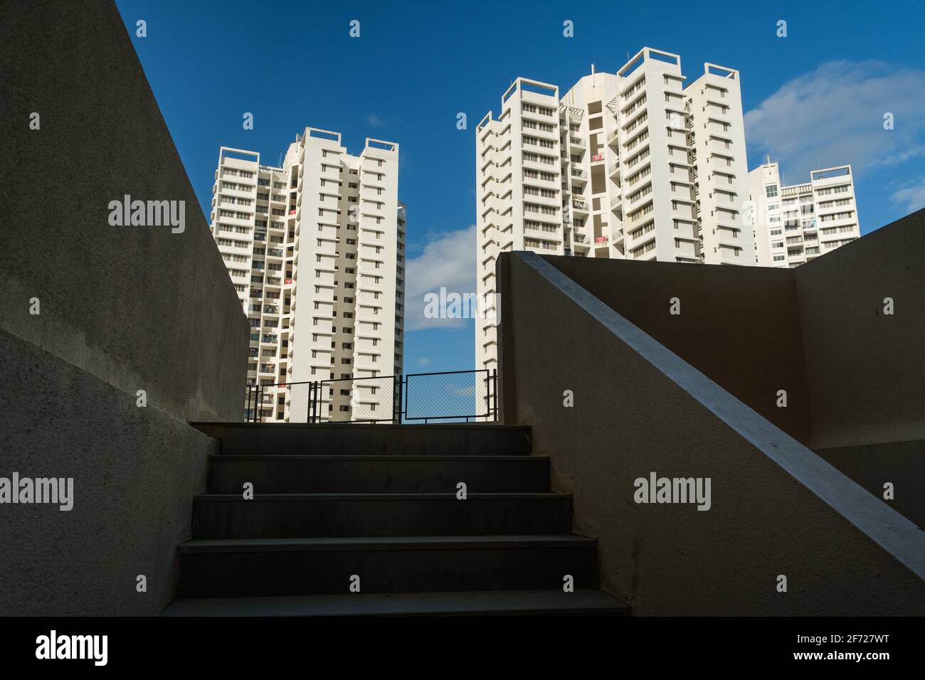High-rise modern day building apartments in bright daylight, open spacious, pollution free space to live Stock Photo
