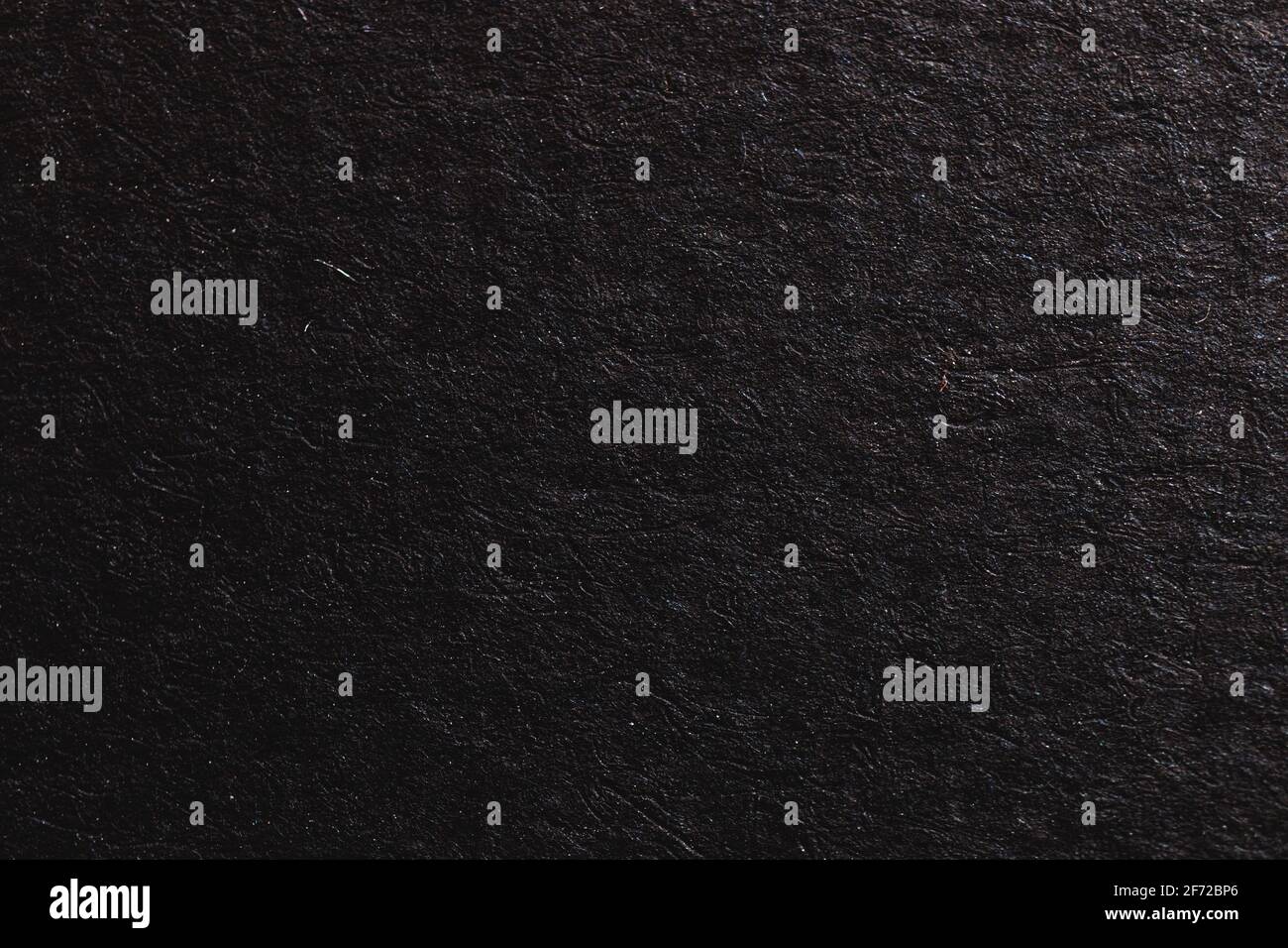 Black paper texture, grainy paper surface background, empty space photo Stock Photo