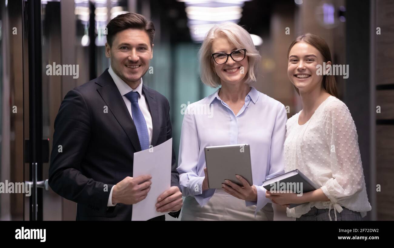 Portrait of smiling diverse employees posing in office Stock Photo - Alamy
