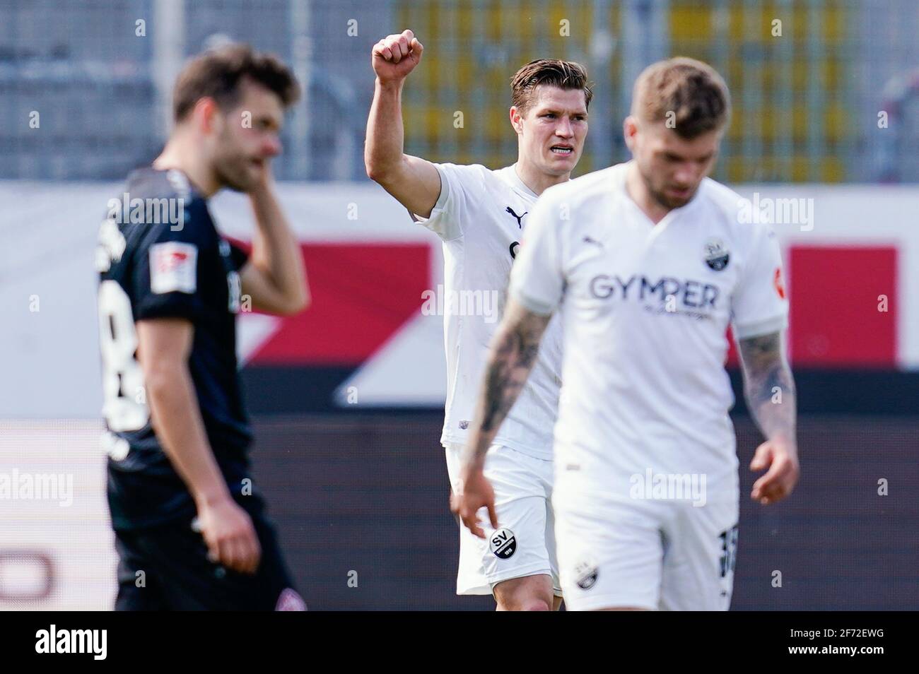 Sandhausen, Germany. 04th Apr, 2021. Football: 2nd Bundesliga, SV Sandhausen - Würzburger Kickers, Matchday 27, Hardtwaldstadion. Sandhausen's goal scorer Kevin Behrens (centre) celebrates the penalty goal for 1:0. Credit: Uwe Anspach/dpa - IMPORTANT NOTE: In accordance with the regulations of the DFL Deutsche Fußball Liga and/or the DFB Deutscher Fußball-Bund, it is prohibited to use or have used photographs taken in the stadium and/or of the match in the form of sequence pictures and/or video-like photo series./dpa/Alamy Live News Stock Photo