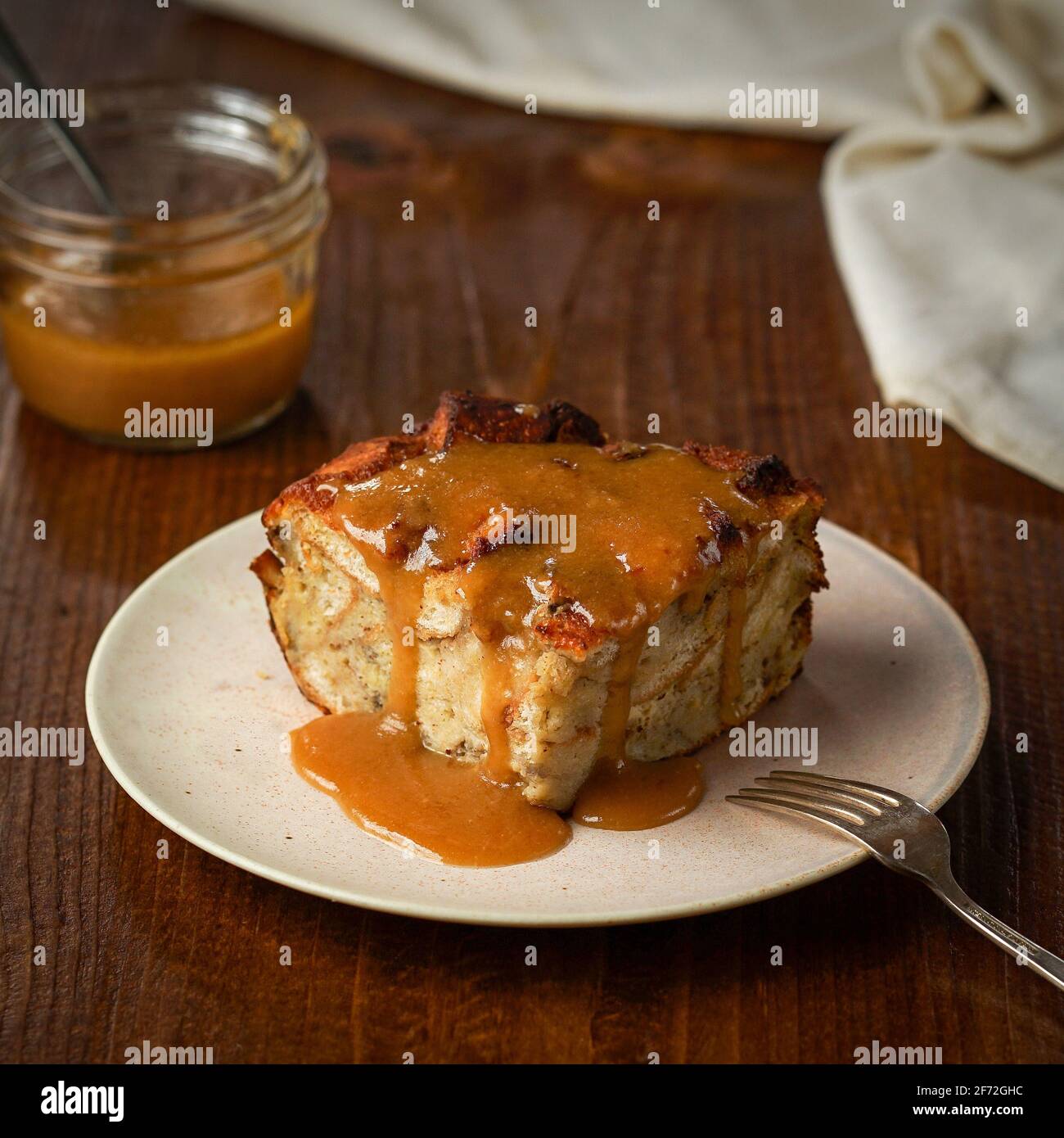 Apple bread pudding with caramel sauce Stock Photo Alamy