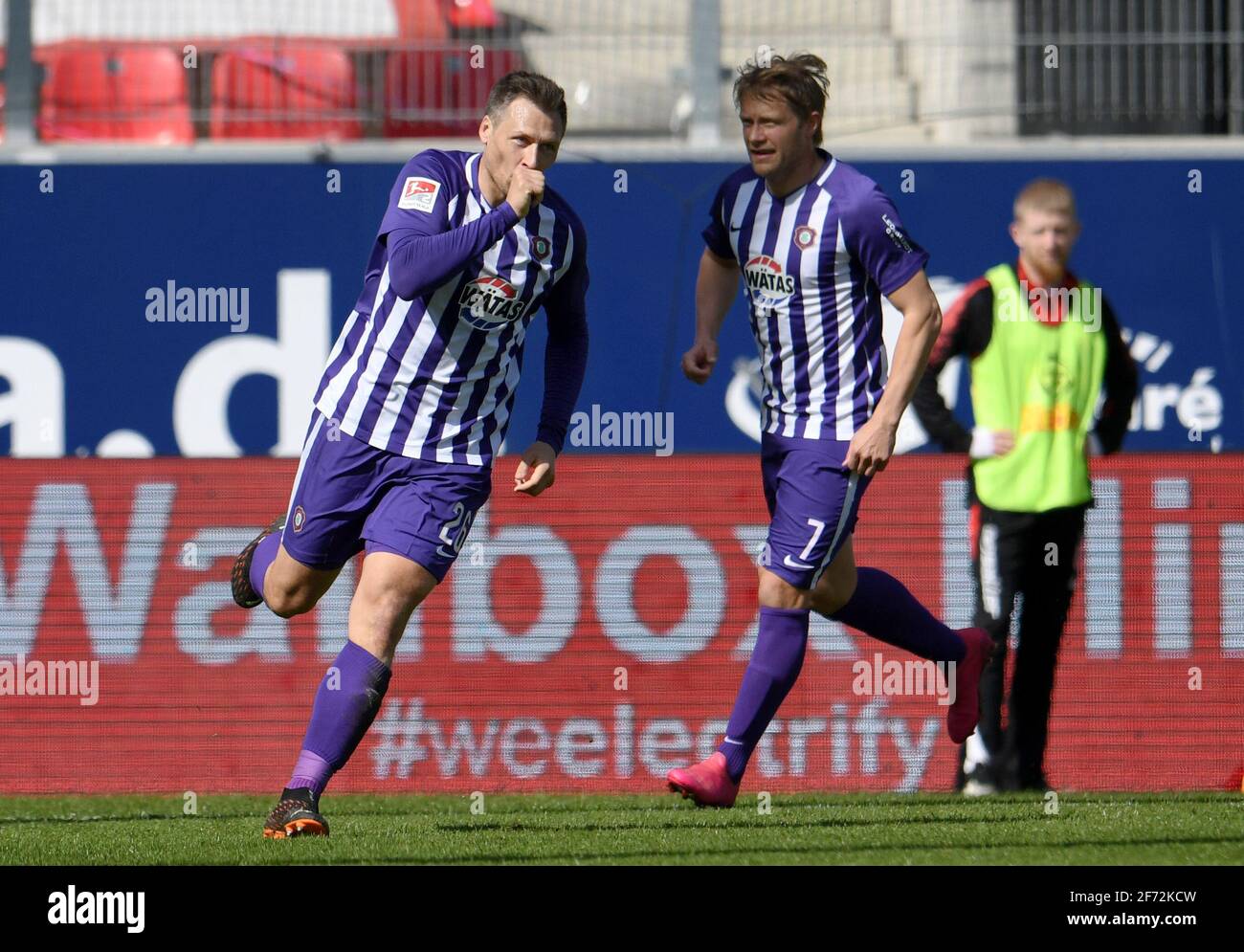 Regensburg, Germany. 04th Apr, 2021. Football: 2. Bundesliga, Jahn  Regensburg - Erzgebirge Aue, Matchday 27 at Jahnstadion. Sören Gonther (l)  of Aue cheers with his thumb in his mouth after his goal