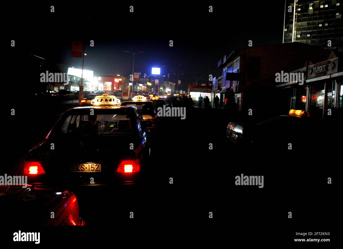 A taxi driver waiting for customers in central Pristina, Kosovo. Stock Photo