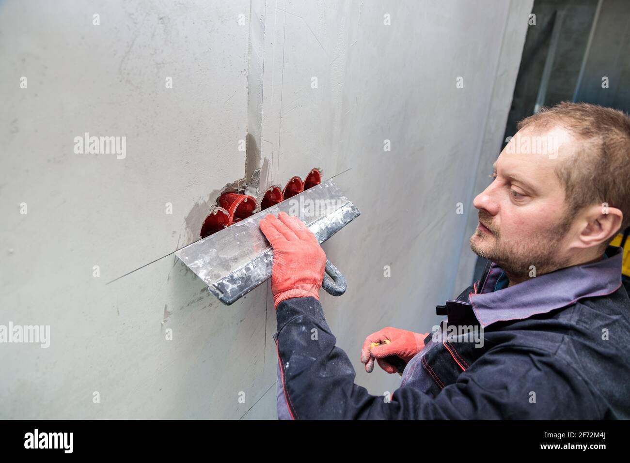 The electrician will plaster holes and channels for sockets and wires