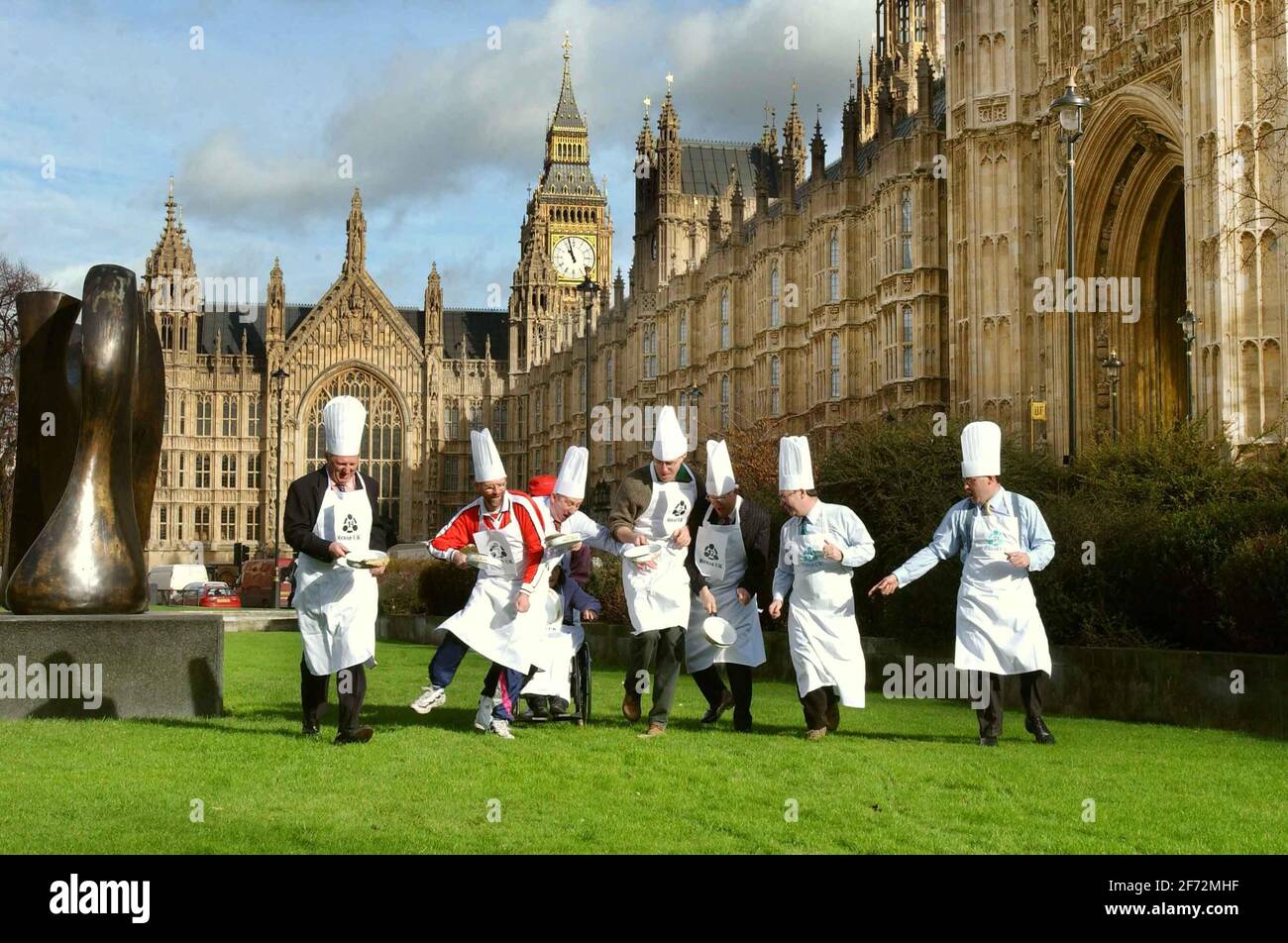 MP's and peers take part in Shrove Tuesday Parliamentary Pancake Race on College Green this morning.12 February 2002 photo Andy Paradise Stock Photo