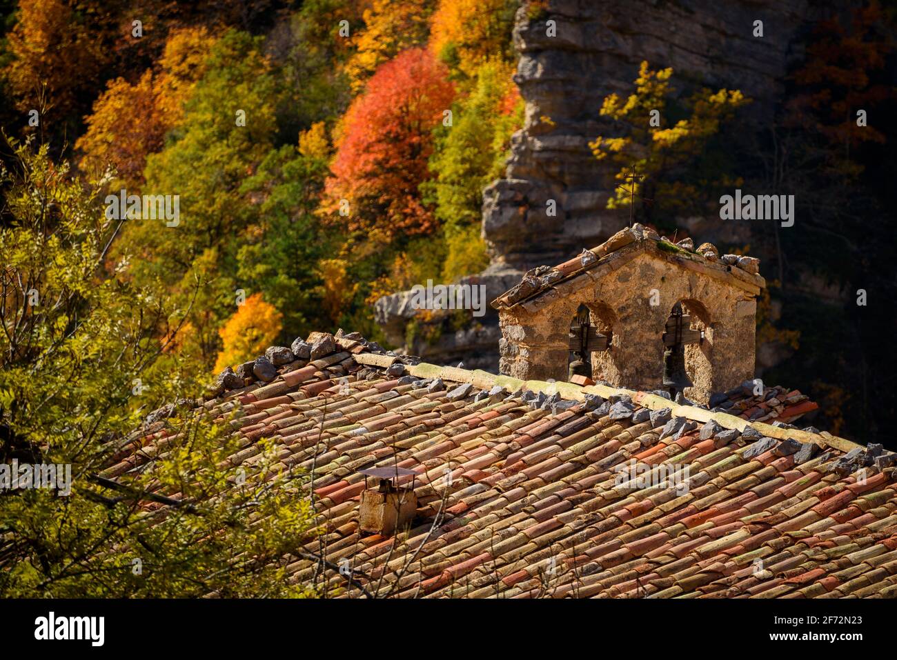 Gresolet sanctuary and beech foirest in autumn, under the Pedraforca massif (Cadí-Moixeró Natural Park, Catalonia, Spain, Pyrenees) Stock Photo