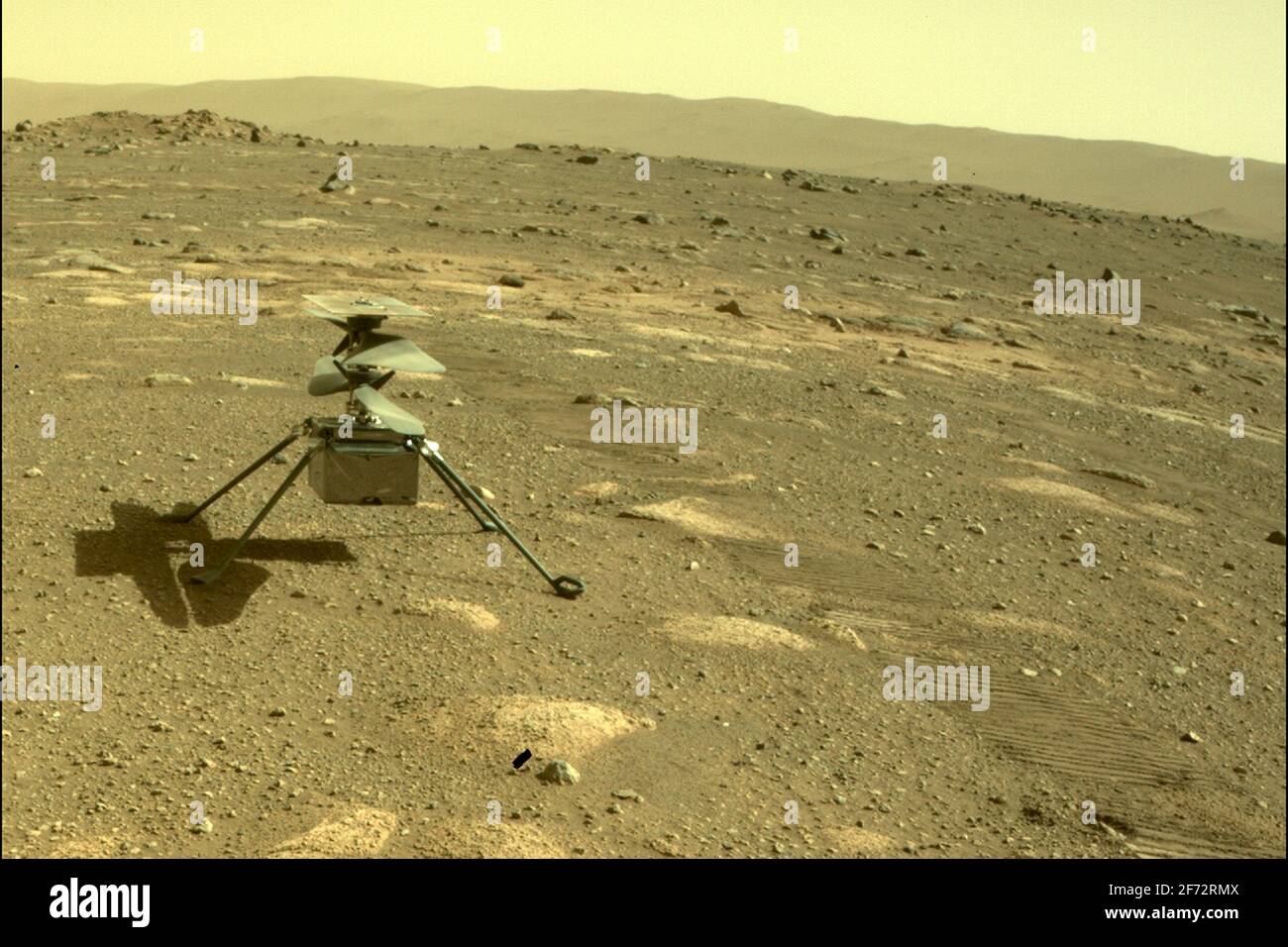 Washington, United States. 04th Apr, 2021. NASA's Mars Perseverance rover acquired this image of the Ingenuity Mars Helicopter using its onboard Rear Left Hazard Avoidance Camera on April 4, 2021 (Sol 43). NASA is targeting no earlier than April 8 for the Ingenuity Mars Helicopter to make the first attempt at a powered, controlled flight of an aircraft on another planet. NASA/UPI Credit: UPI/Alamy Live News Stock Photo