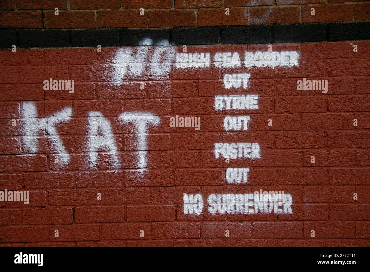 Grafitti in the loyalist Fountain estate in Derry opposing the Irish sea border, the DUP and the PSNI. KAT stands for Kill all Taigs (Catholics). Stock Photo