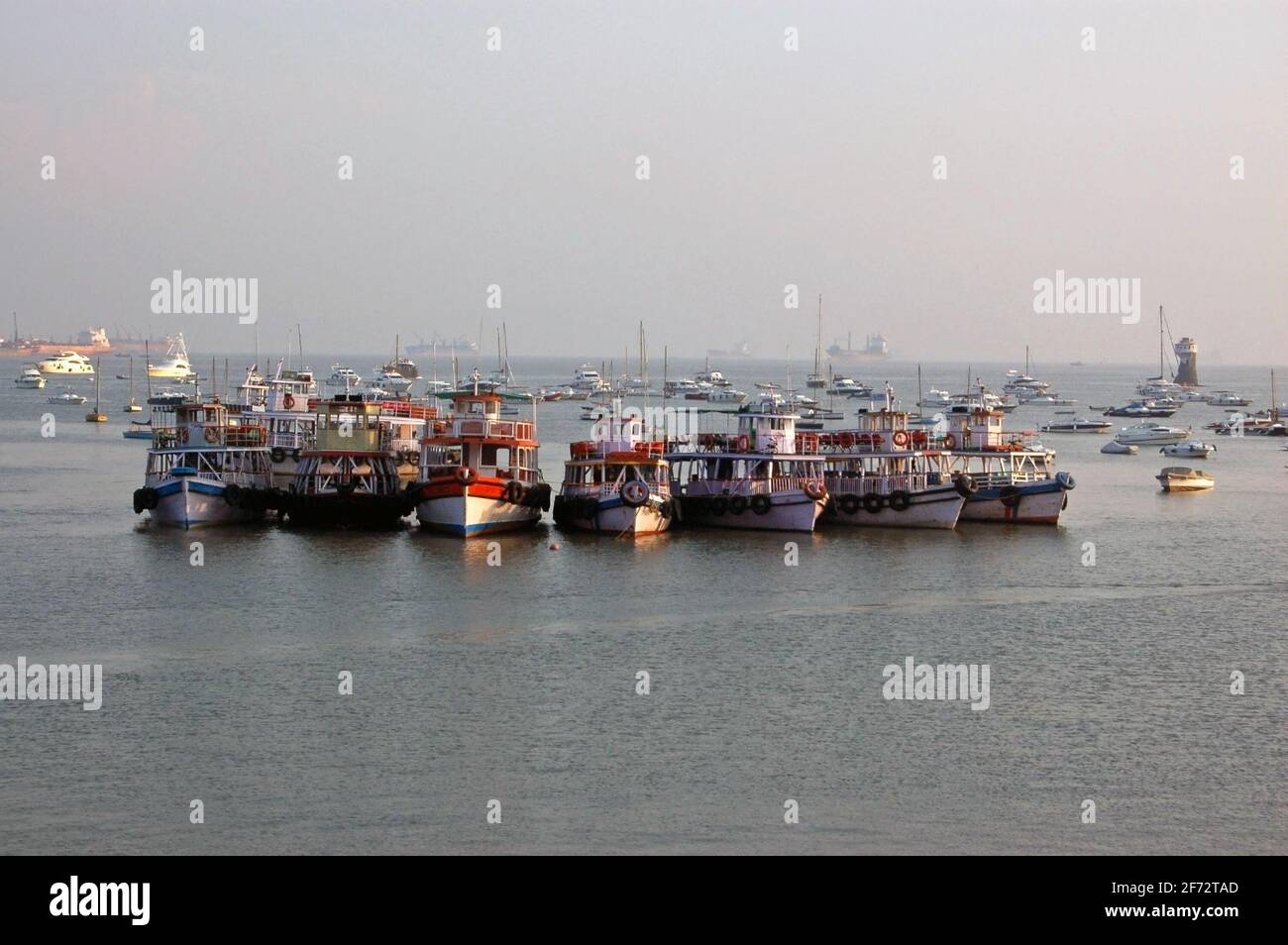 A group of passenger boats moored in the harbour in the Colaba district of Mumbai, India. Stock Photo