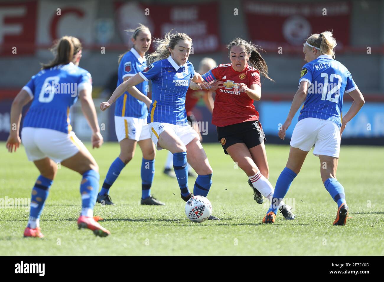 Crawley, UK. 4th Apr, 2021. Katie Zelem of Manchester inited is challenged by Megan Connolly of Brighton and Hove Albion during the FA Women's Super League match between Brighton & Hove Albion Women and Manchester United Women at The People's Pension Stadium on April 4th 2021 in Crawley, United Kingdom Credit: Paul Terry Photo/Alamy Live News Stock Photo