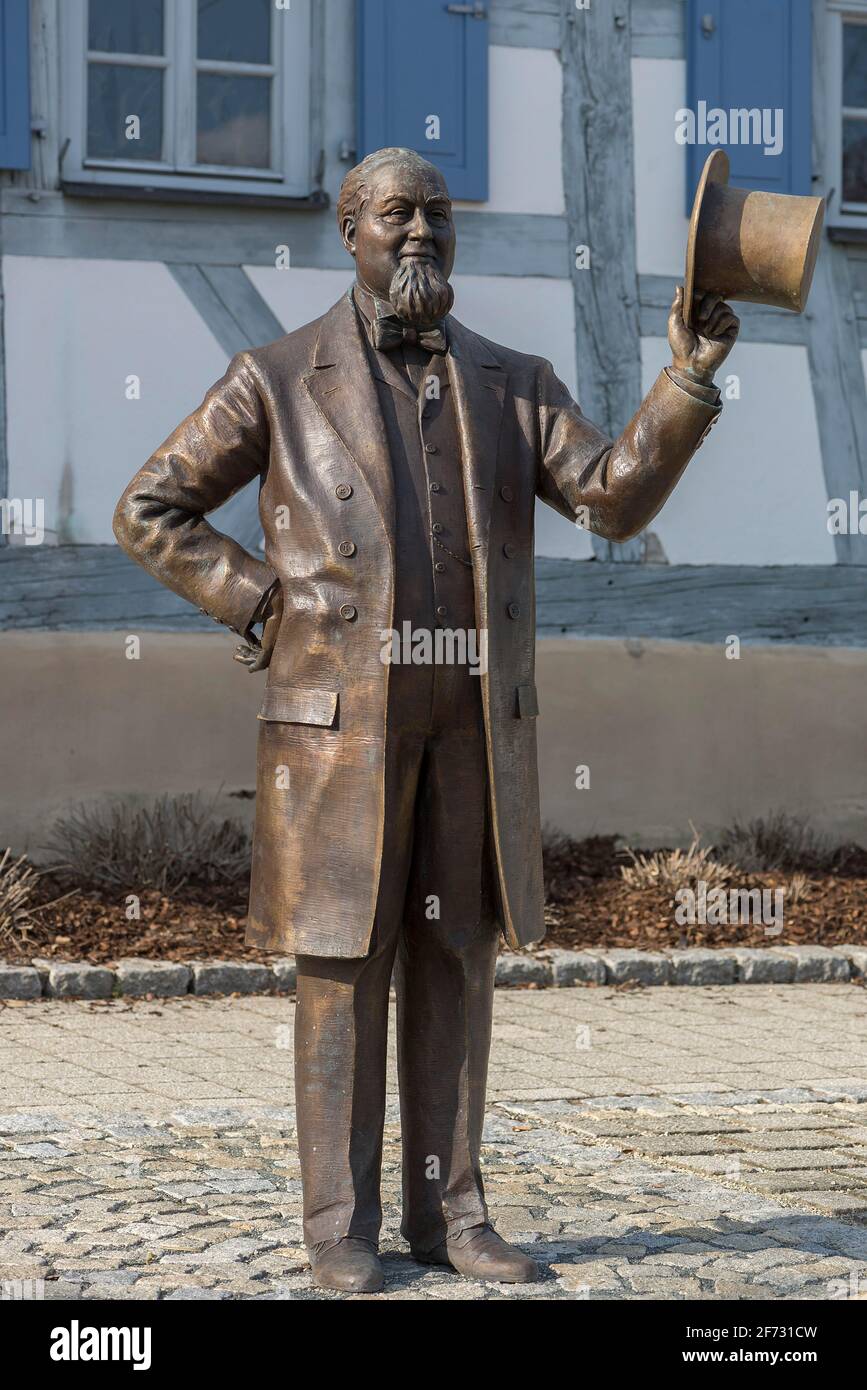 Bronze sculpture of Levi Strauss in front of his birthplace, today museum, bronze figure created by artist Rainer Kurka 2020, Buttenheim, Upper Stock Photo