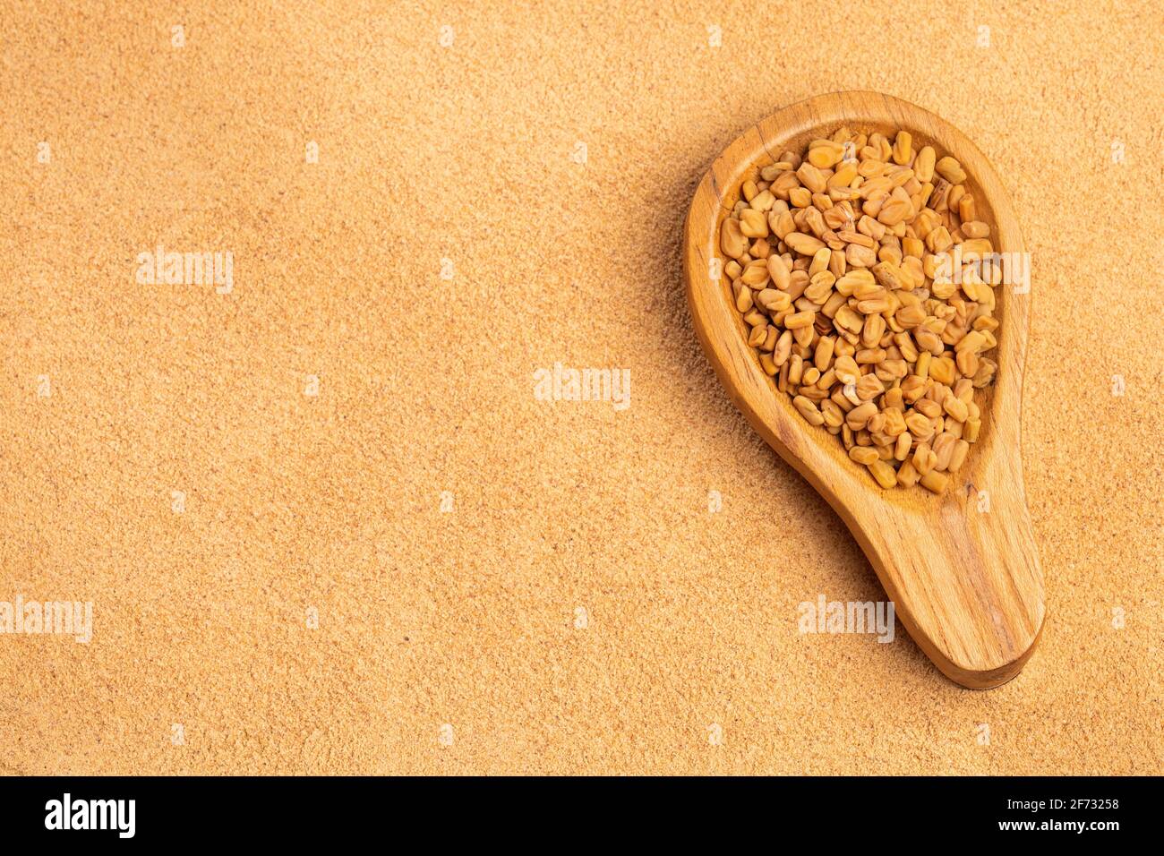 organic fenugreek seeds powder - Trigonella foenum - graecum Stock Photo