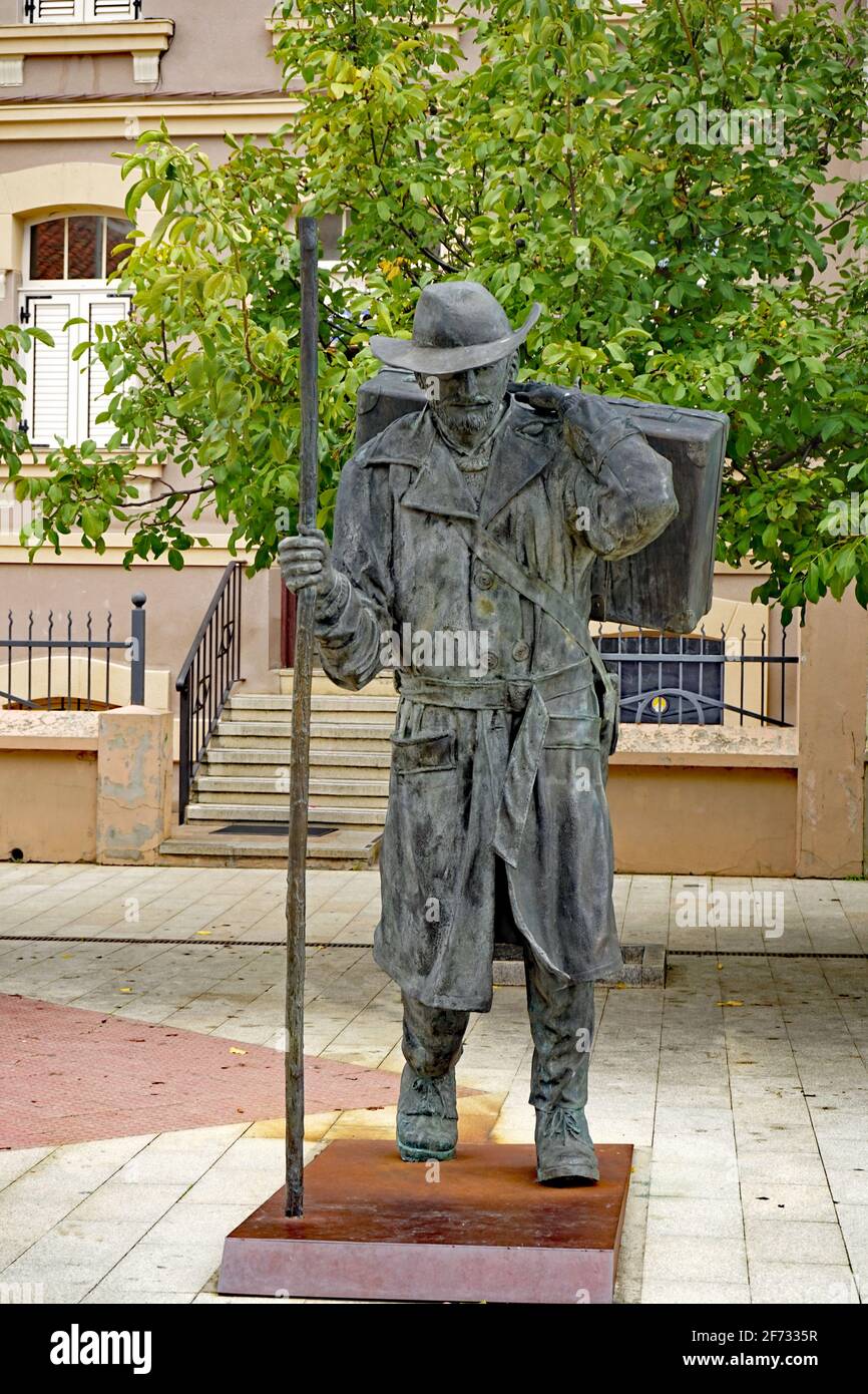 Statue of a rich pilgrim with hat and suitcase in the town Astorga, October 2020, Jakobsweg, Way of St. James, Camino de Santiago Stock Photo