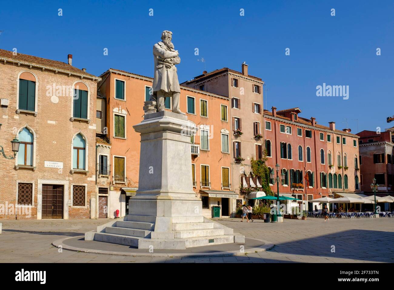 Monument to Niccolo Tommaseo, 1802-1884, Italian writer and lexigrapher, statue by Francesco Barzaghi, Campo Santo Stefano, Venice, Veneto, Italy Stock Photo