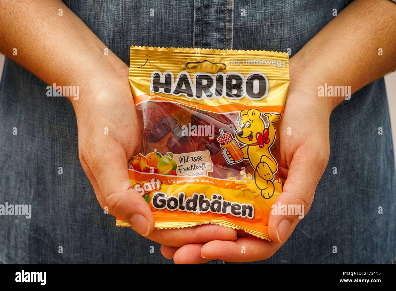 Tambov, Russian Federation - January 06, 2021 Woman palms with pack of Haribo Bears gummy candies. Stock Photo