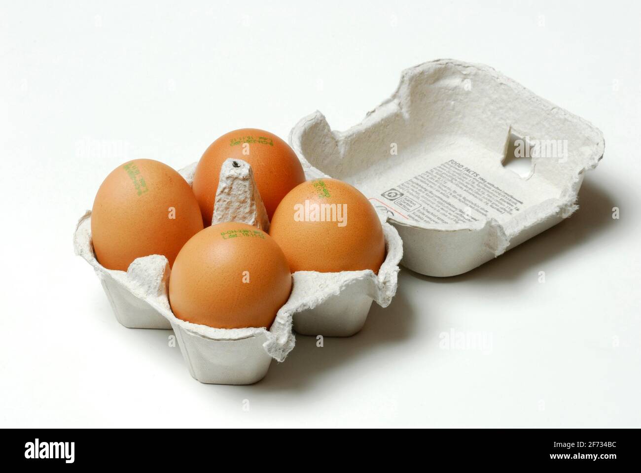 Brown hen's eggs, hen's eggs, hen's egg, stamp of origin, laying date, organic Stock Photo