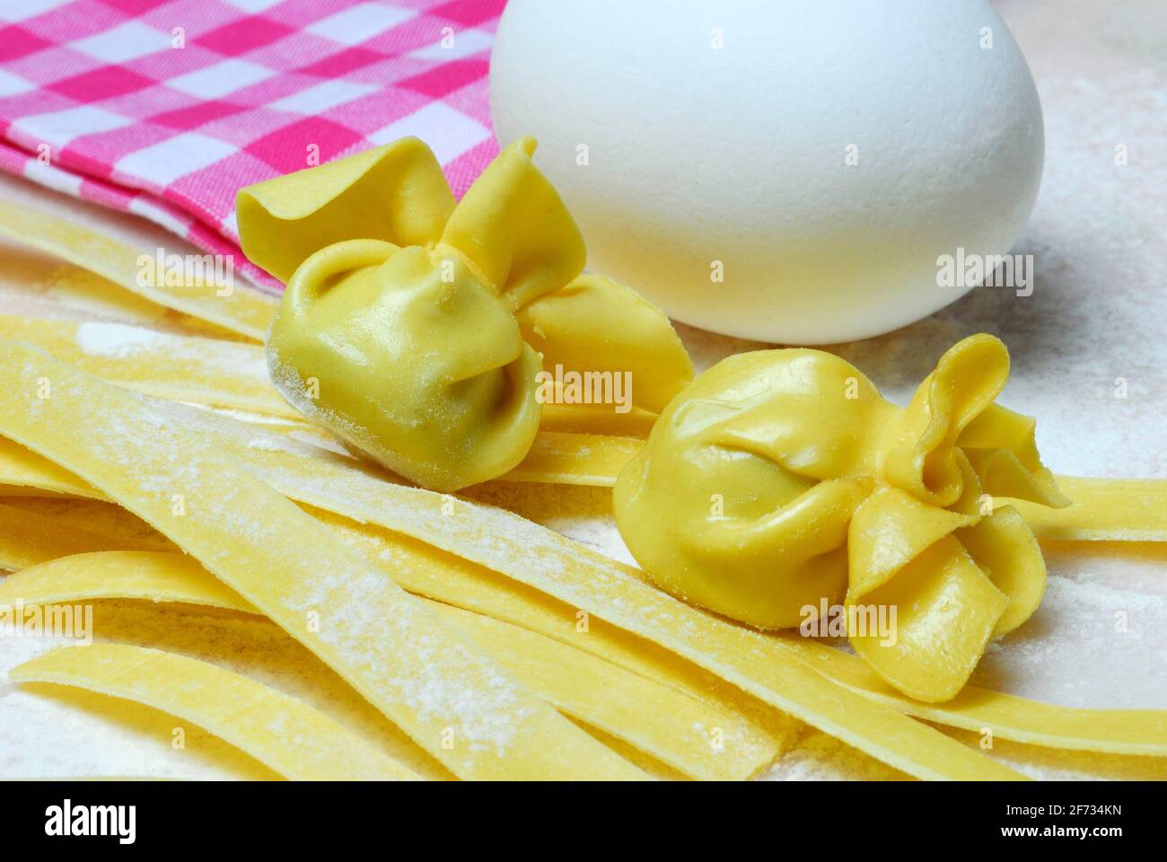 Tagliatelle and filled dough pearls, hen's egg, ribbon noodles, pearl