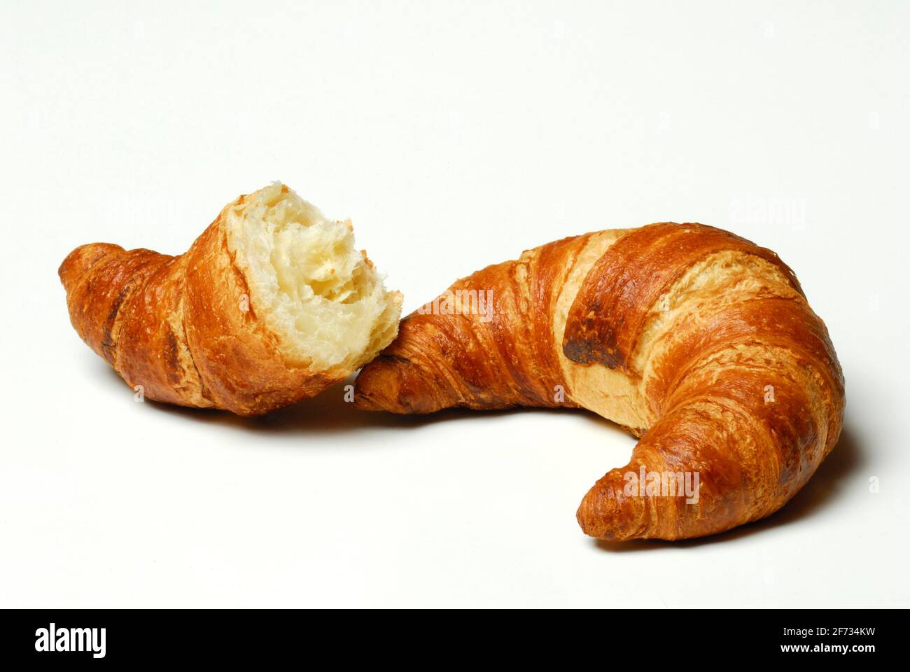 Croissants, whole and half croissant, bakery products, breakfast Stock Photo