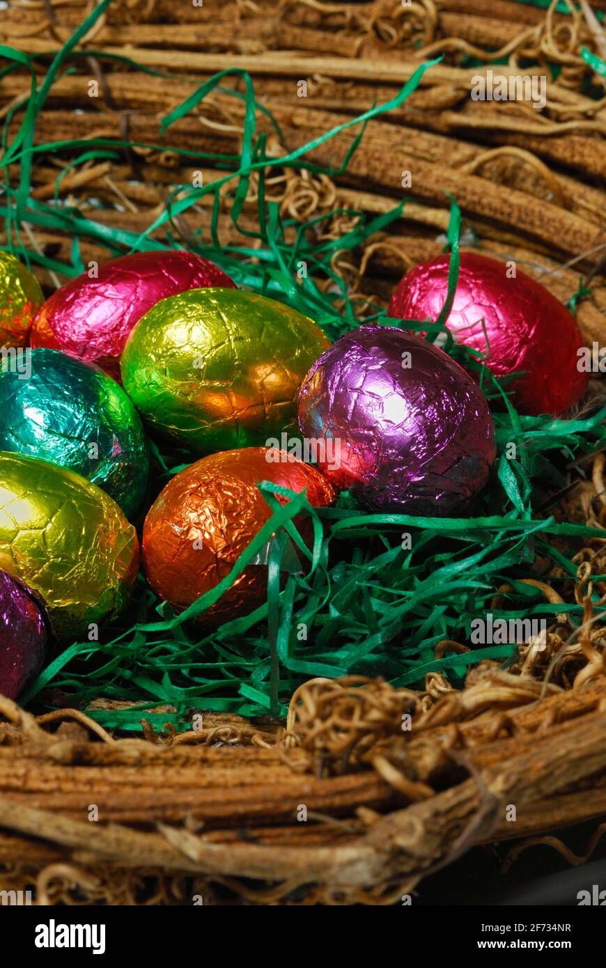 Chocolate eggs in basket, basket, chocolate eggs, easter eggs, sweets, chocolate, chocolate easter eggs Stock Photo