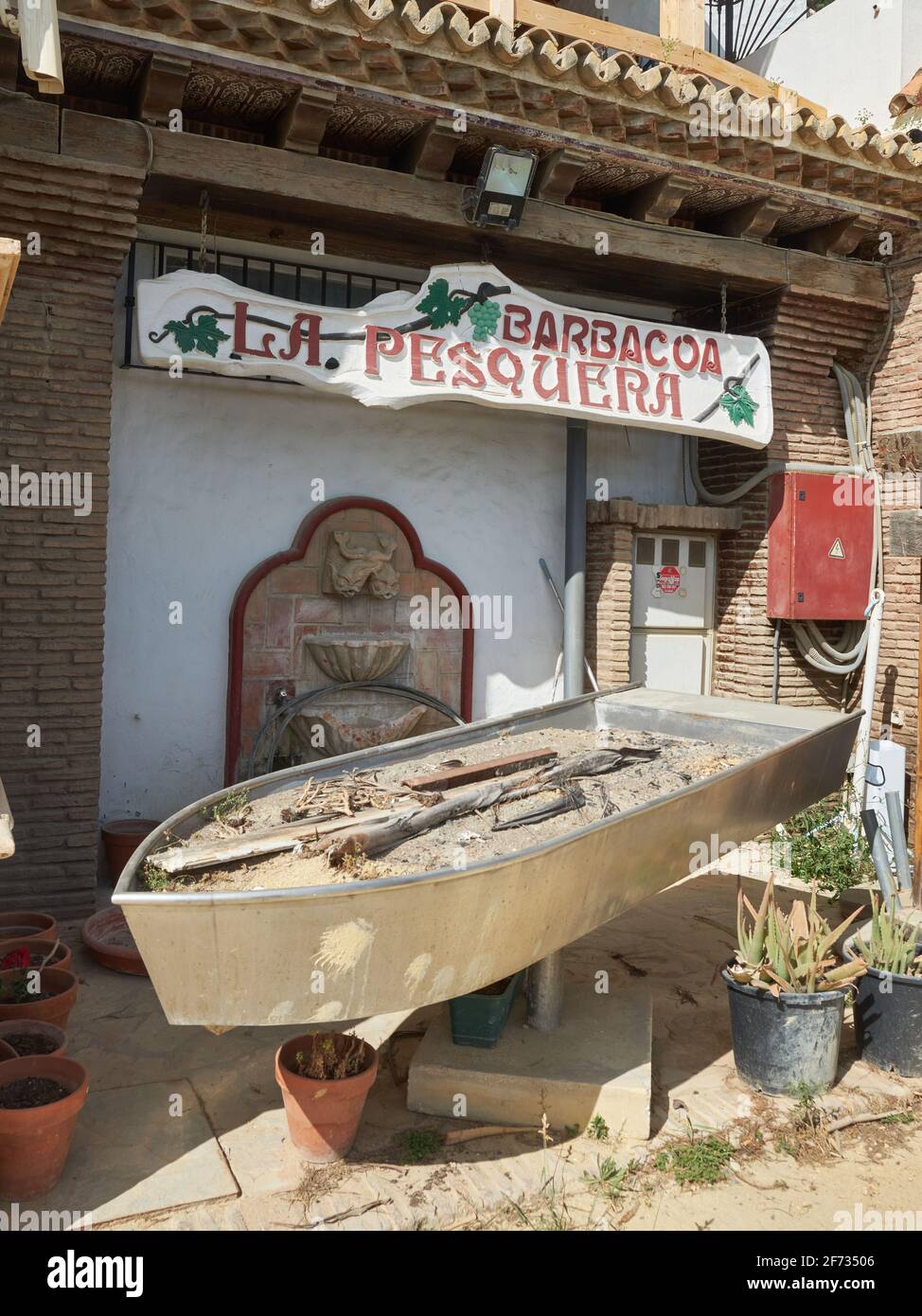 Stainless steell boat barbacue to grill sardines (espetos). La Pesquera  restaurant, Marbella, Malaga province, Andalusia, Spain Stock Photo - Alamy